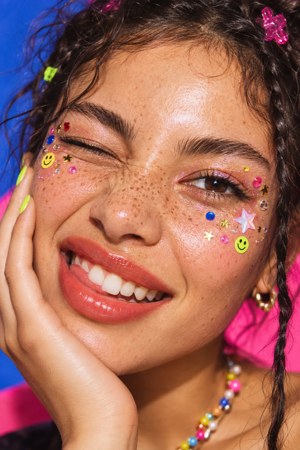 Direct-flash beauty portrait with colorful face gems